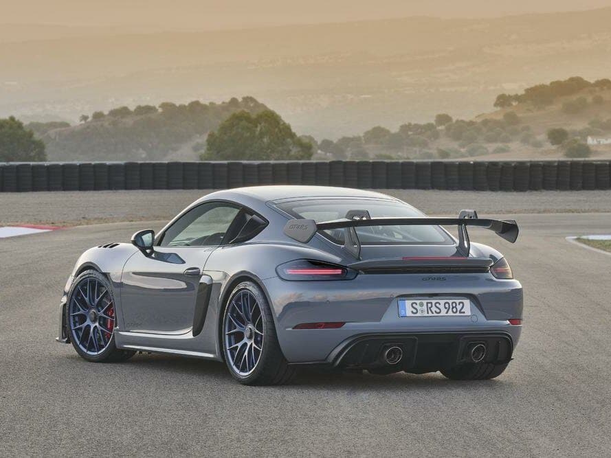 Porsche Cayman GT4 II 718 (982) — 3/4 arxadan