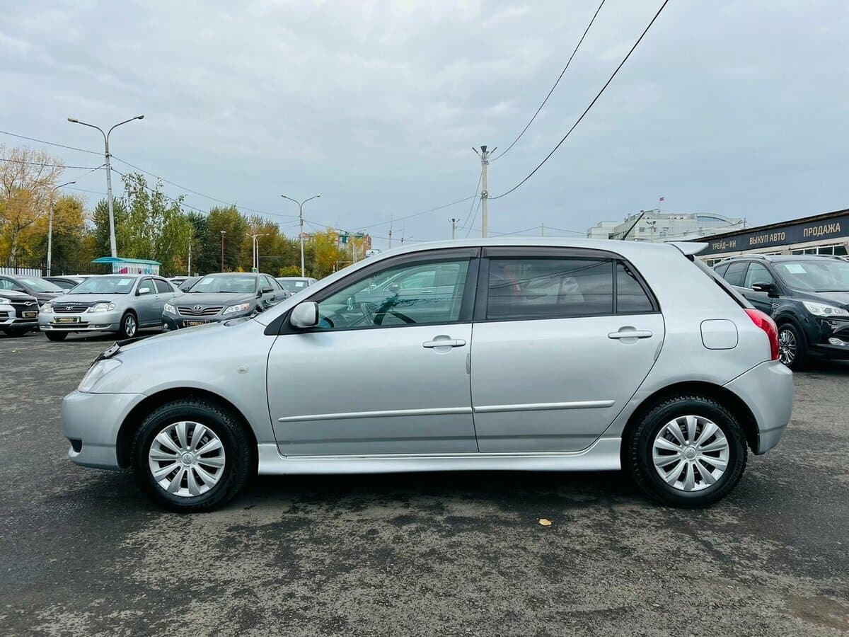 Toyota Corolla IX (E120, E130) Restayling — Yandan
